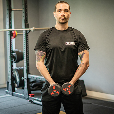 model holding dumbbells