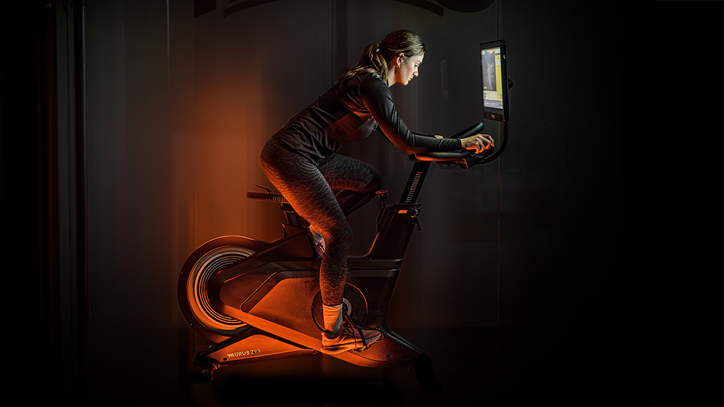 taurus-z9.9-pro-exercise-bike-person-cycling-1024-576 Tour de Fitness: Your Guide to the Best Exercise Bike Choices