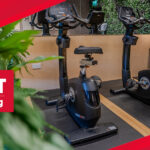 Workplace fitness concept banner with office gym equipment